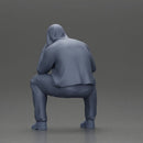 Thoughtful Man in Hoodie Squatting with Hand on His Face - Only-Games