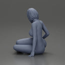 Naked Woman sitting gracefully on the floor with a relaxed pose - Only-Games