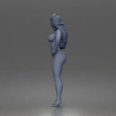 naked woman Standing touches hair bare skin legs bare feet