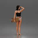 Standing woman holding skateboard wearing halter top and panties