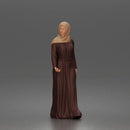 Standing woman looking aside wearing hijab and long belted abaya