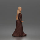 Standing woman looking aside wearing hijab and long belted abaya