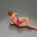 Woman in pink lingerie lying sideways resting arm with soft gaze - Only-Games