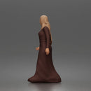 Standing woman looking aside wearing hijab and long belted abaya