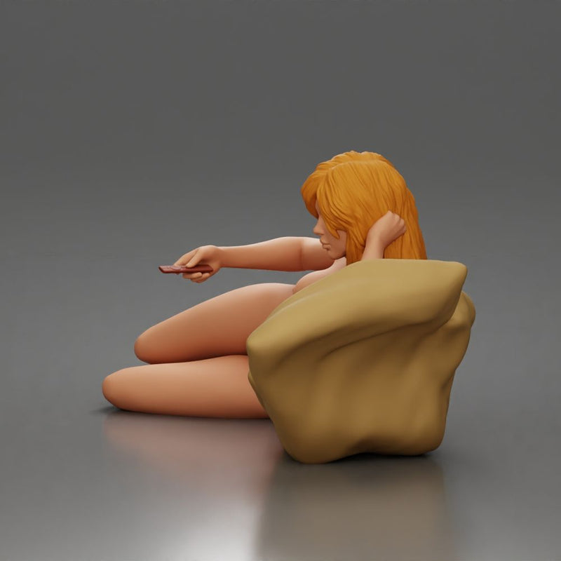 Naked Woman lounges atop pillow watching television holding remote - Only-Games