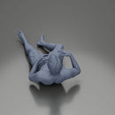 Man in green shorts reclining back raising hands with calm expression - Only-Games