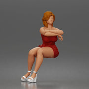 woman sitting thoughtfully in short dress with arms gently crossed - Only-Games