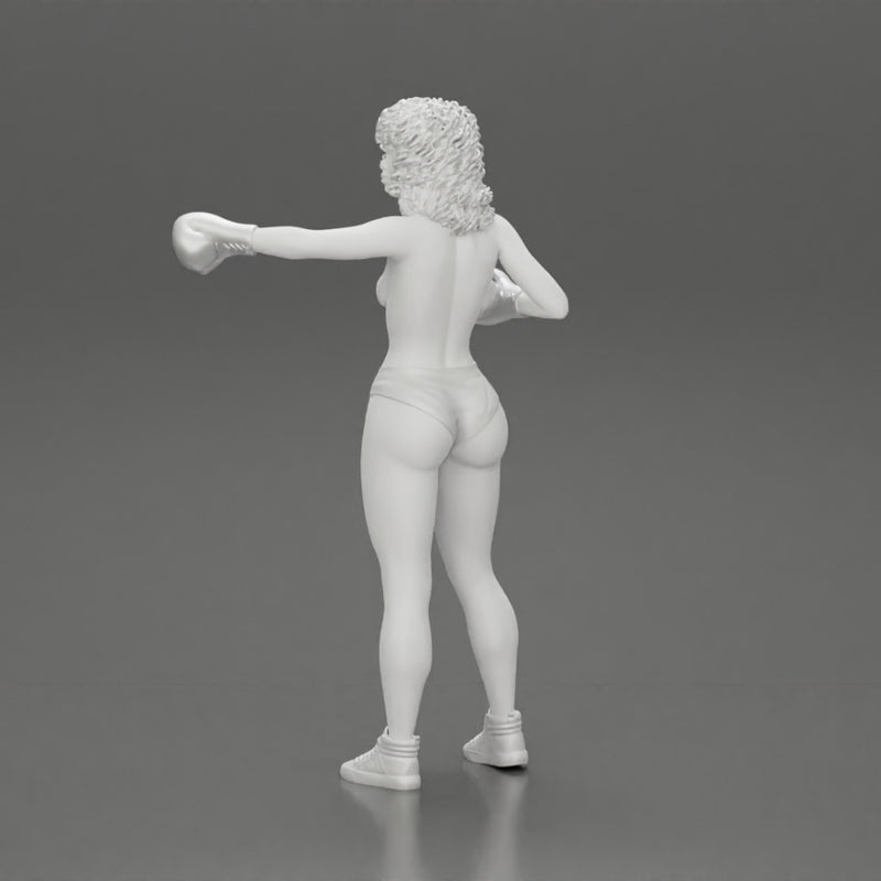 black naked breasts woman in boxing gloves with curly hair ready to finish off her opponent - Only-Games