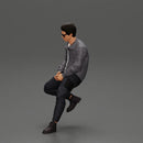 man sitting on a car, wearing a jacket and sunglasses, deep in thought - Only-Games