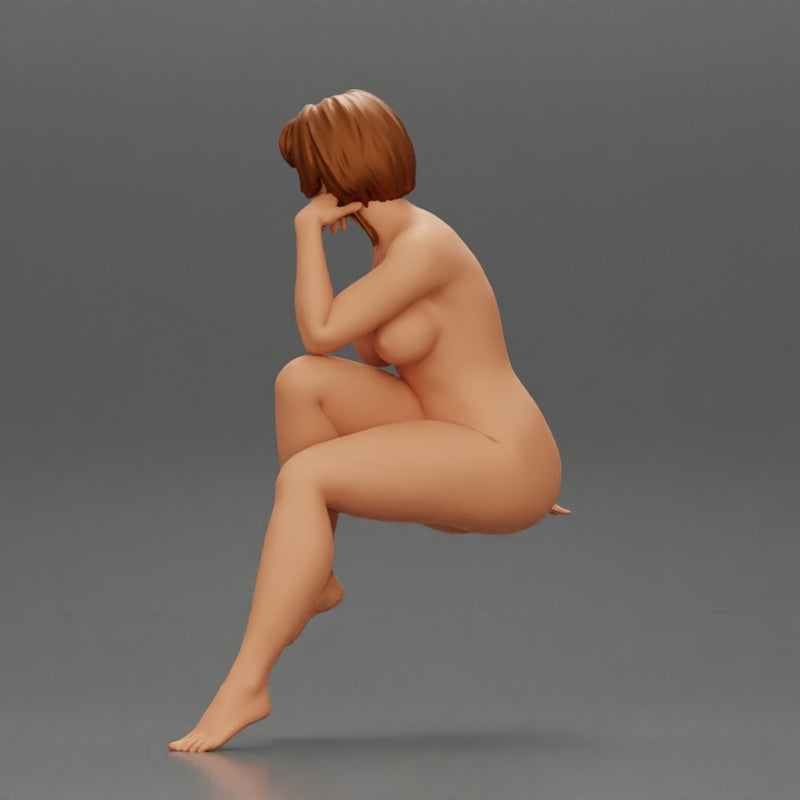 Naked woman sitting thinking