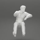 businessman sitting in his car holding steering wheel leaning his left arm on the window - Only-Games