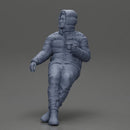 Man Sitting Wearing a Puffer Jacket, Holding a Coffee Cup - Only-Games