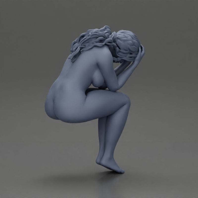 naked sad girl sitting and crying with her hands covering her face