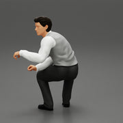 young businessman sitting and holding briefcase of money - Only-Games