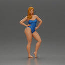 Elegant pose in blue swimsuit showcasing confidence and grace - Only-Games
