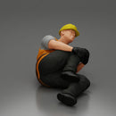 construction worker lying on the floor holding his injured leg - Only-Games