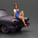 sexy girl in short denim overalls and heels is sitting on the car - Only-Games