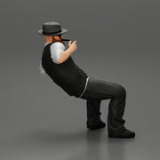 gagnster homie in beard and hat sitting holding lighter cigar while smoking - Only-Games