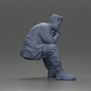 Thoughtful Man Squatting in Casual Outfit, Deep in Contemplation - Only-Games