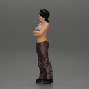 A chola girl with curly hair standing in large pants with crossed hands - Only-Games