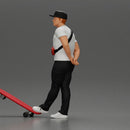 skater man leaning against the wall wearing a cap and banana bag - Only-Games