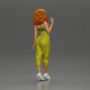 Curly-Haired Woman in Vibrant Green Outfit Striking a Pose - Only-Games