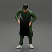 Auto mechanic walking and carrying tyre - Only-Games