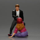 motorbike rider holding a helmet helps a biker girl, who fell off the bike, stand up - Only-Games