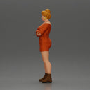 Woman in Orange Dress and Boots Stands Stylishly Confidence With Arms Crossed - Only-Games