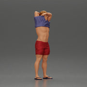 muscular man in shorts taking off his shirt to go swimming - Only-Games