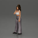 Stylish woman in a crop top and pants, standing thoughtfully - Only-Games