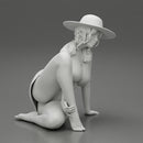 young woman in a summer suit and hat sitting - Only-Games