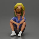 girl standing behind her boyfriend gently touching his face while he sits on the floor in shorts with his hands on his knees - Only-Games