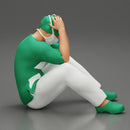 Thoughtful Surgeon Sitting  With His Hand On Head - Only-Games