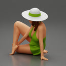 young woman in a summer suit and hat sitting - Only-Games