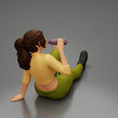 Tired woman mechanic in sexy shirt pants sitting and drinking water during from bottle - Only-Games