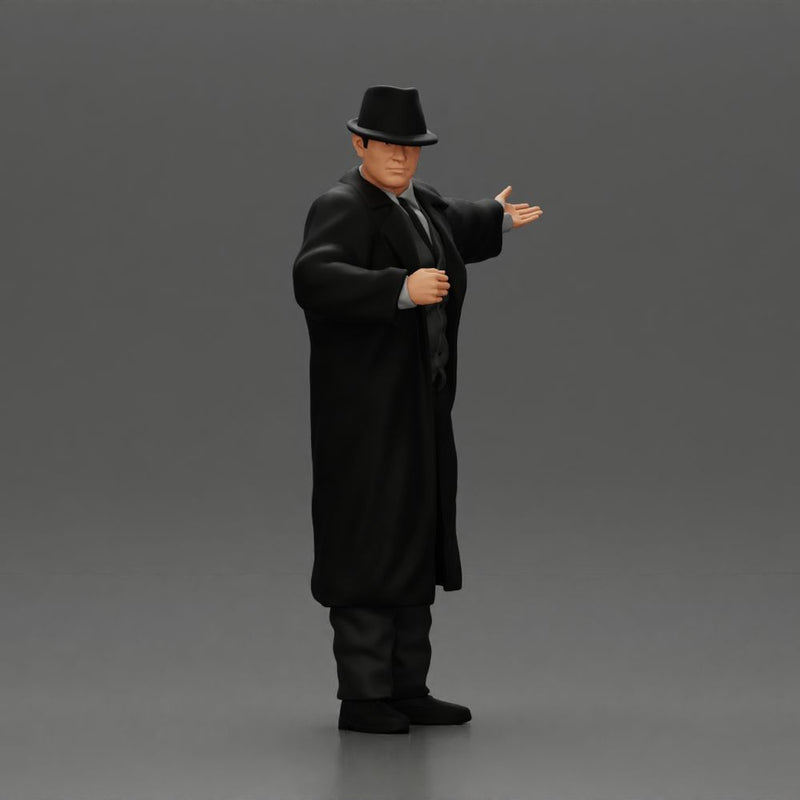 mafia man in gangster costume stands confidently while gesturing with his hands as if presenting something