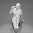 Tired woman mechanic in suit and backwards cap sitting and drinking water during from bottle - Only-Games