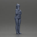 policewoman standing hand resting on her back speaking into a radio - Only-Games