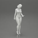 Beautiful girl in onepiece bikini standing on the beach - Only-Games