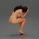 naked sad girl sitting and crying with her hands covering her face - Only-Games