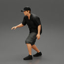 Man bent over while walking in cap - Only-Games