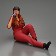 Tired woman mechanic in suit and cap sitting and drinking water during from bottle - Only-Games