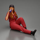 Tired woman mechanic in suit and cap sitting and drinking water during from bottle - Only-Games