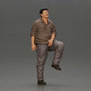 Fat Asian man looking upward in shirt and pants with one leg placed on a step - Only-Games