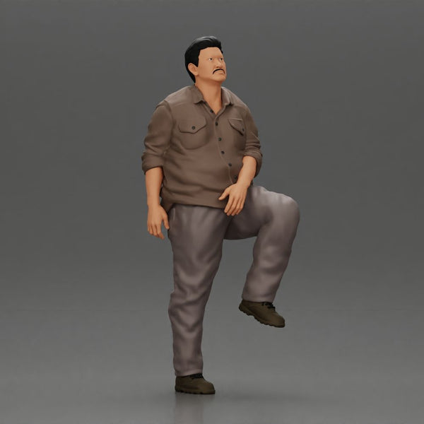 Fat Asian man looking upward in shirt and pants with one leg placed on a step