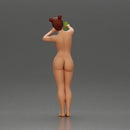 Naked woman taking a selfie with her phone on the beach - Only-Games