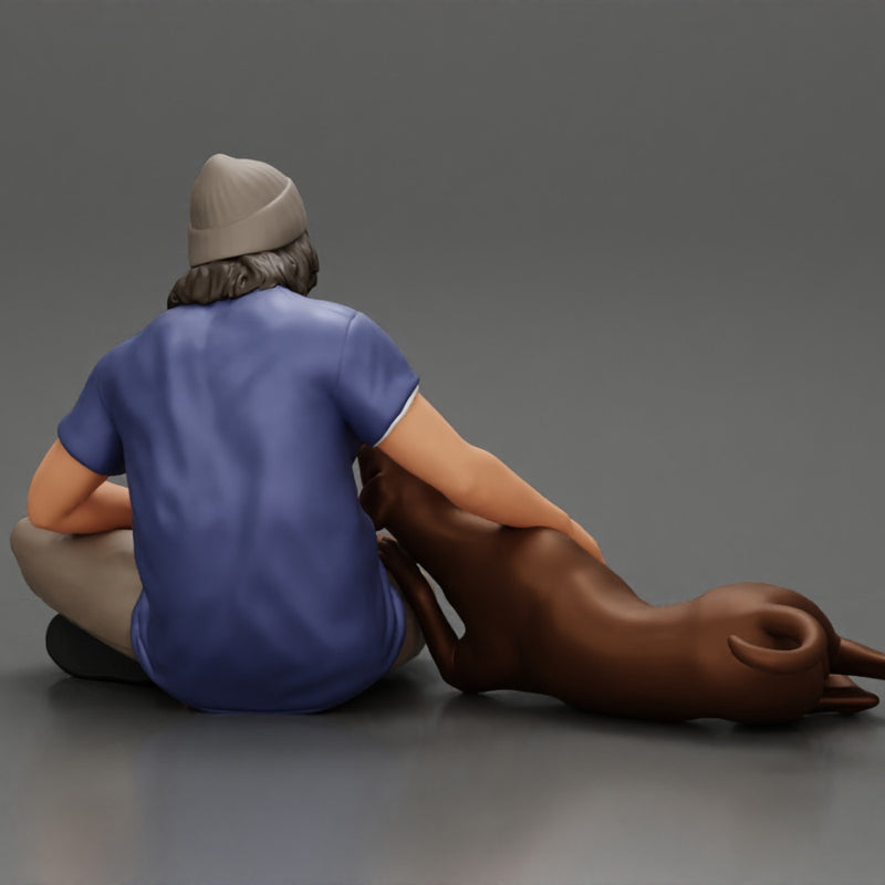 young man in a bonnet sitting crossing his legs and hugging a dog