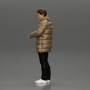 Man in long puffer jacket standing with his hand in his pocket lost in thought - Only-Games