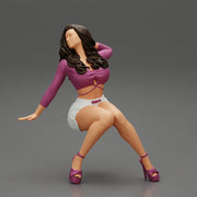 Young sexy girl in shorts with long hair is sitting with one hand in hair - Only-Games